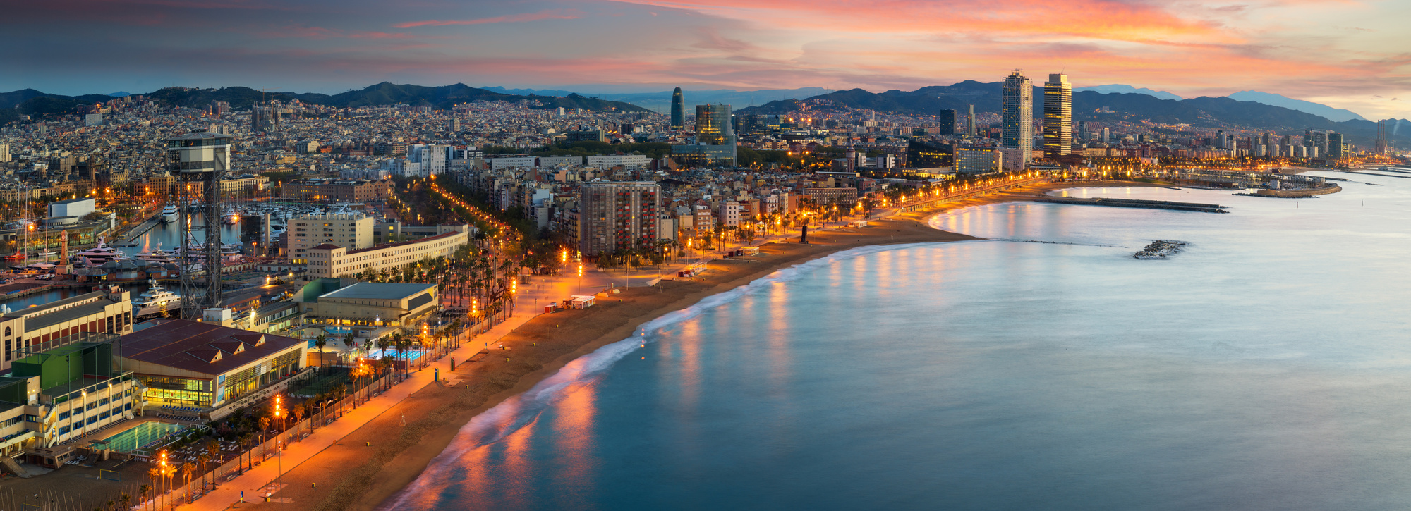 Barcelona beach on morning sunrise with Barcelobna city and sea from the roof top of Hotel